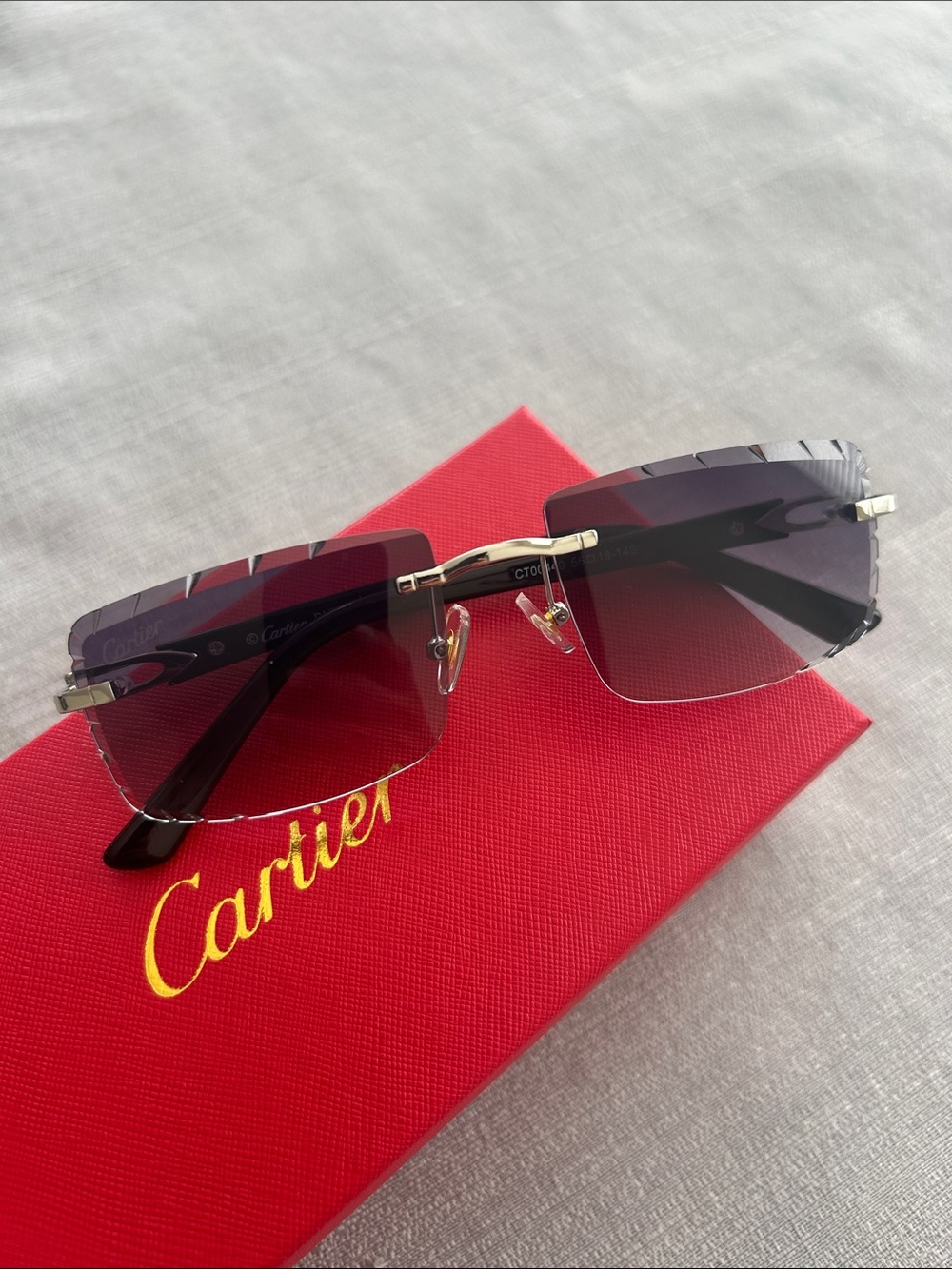 Cartier Rimless Sunglasses with Black Temples and Gray Gradient Lenses